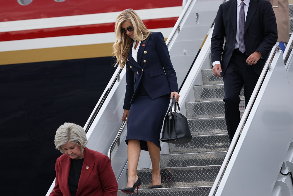 New White House Press Secretary Katie Zacharia arrives with President Donald Trump on October 13, in Alaska, hours after her ‘trainwreck’ first press briefing. (Getty)