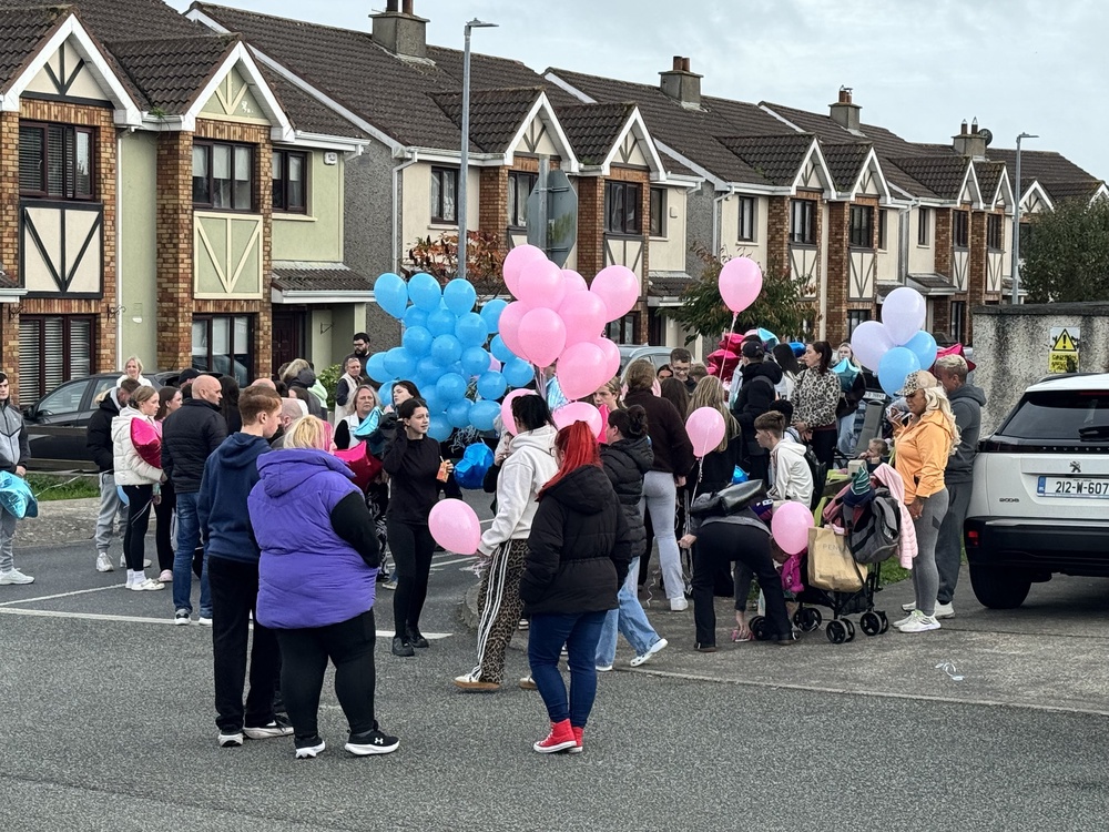 People gather ahead of a balloon release ceremony (Mícheál Ó Scannáil/PA)