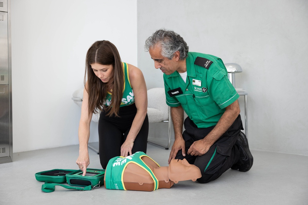 Nikki Sanderson with St John Ambulance volunteer Kash Mahmood (PA) (PA Wire)