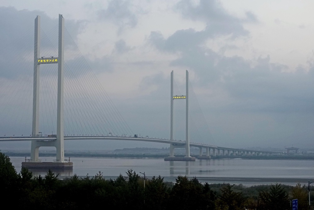 The China-North Korea Yalu River Bridge is seen from Dandong, China, at the border between the two countries Thursday, Oct. 15, 2026 (Iori Sagisawa/Kyodo News via AP)