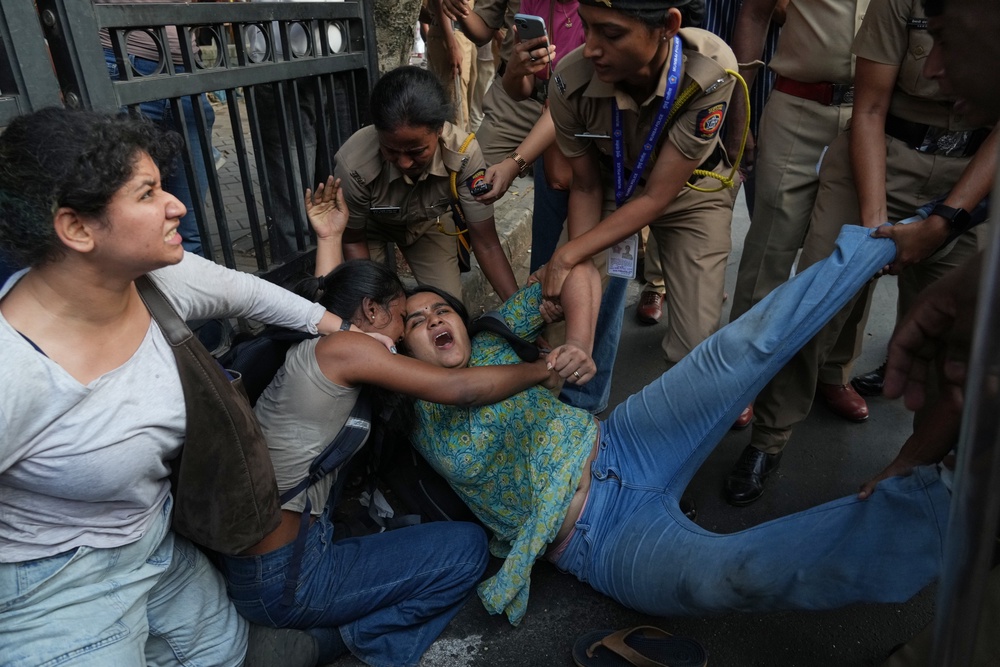 Protesters are detained by police during a protest demanding the resignation of the country's election chief, Gyanesh Kumar, in Mumbai (AP)
