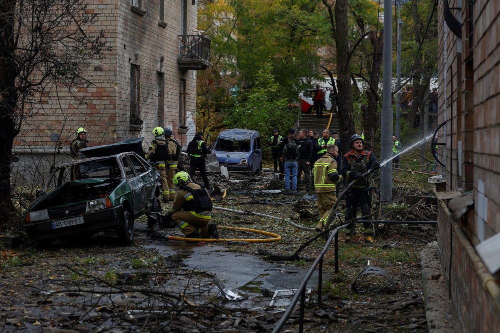 The aftermath of a Russian drone strike in Kyiv on Thursday, as Ukraine said they had been left without US early-warning alerts for incoming ballistic missiles (Reuters)