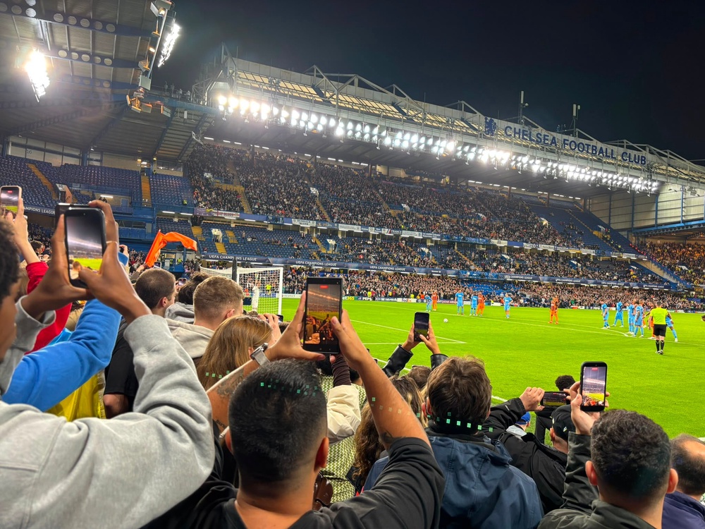 Fans ready their phones for a first-half penalty (and yes, our reporter is one of them) (Kieran Jackson)