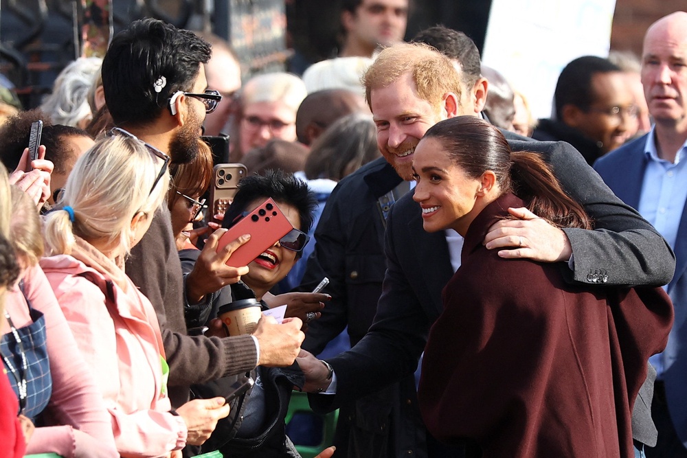 Prince Harry and Meghan greeting fans in Nottingham (Reuters)