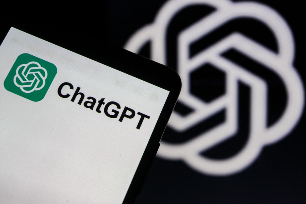 A smartphone displaying the ChatGPT application logo is photographed in front of an OpenAI logo screen in Tunis,Tunisia on 20 May,2026 (AFP/Getty)