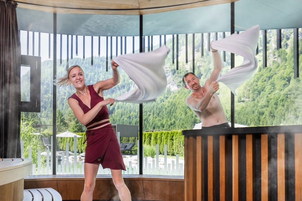 Janine and Andi showing off the skill of Aufguss (Caroline Gammell/The Independent)