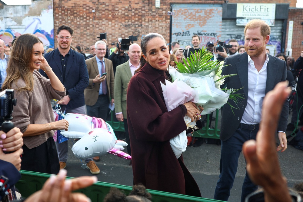 The couple were handed a balloon of a unicorn (Reuters)