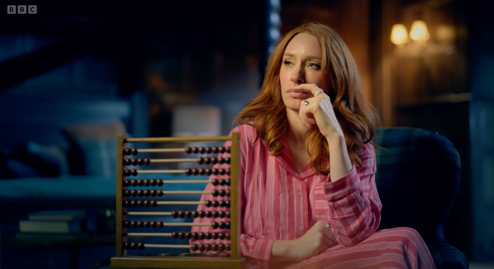 Hannah Fry making good use of an abacus on ‘Celebrity Traitors’ (BBC)