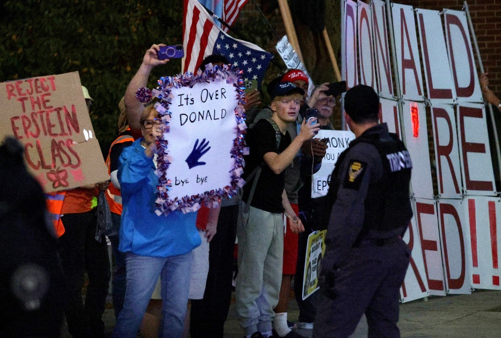 Protesters gather outside of the Covelli Centre as the motorcade of President Donald Trump passes before the start of a campaign rally on October 12, 2026 in Youngstown (Getty)