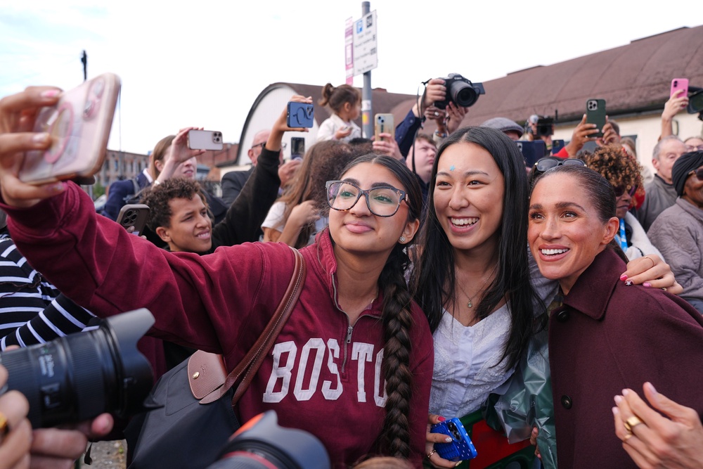 Meghan takes selfies with fans during her visit to Nottingham (AP)