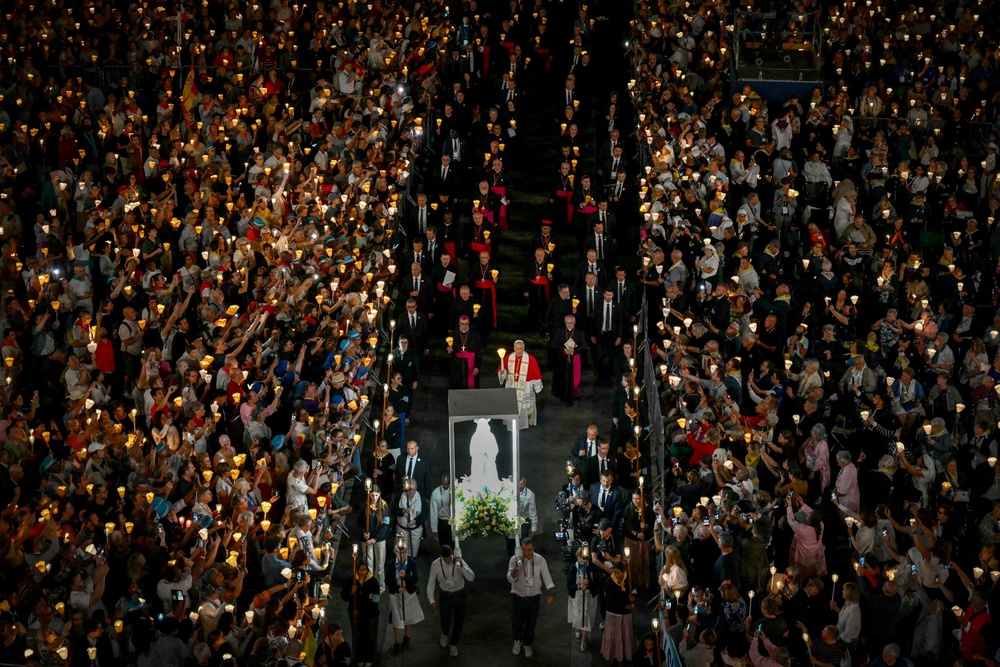 Pope Leo XIV takes part in a torchlight procession following the Rosary Prayer at the Shrine of Our Lady of Lourdes, southwestern France, on September 27, 2026 (AFP via Getty Images)