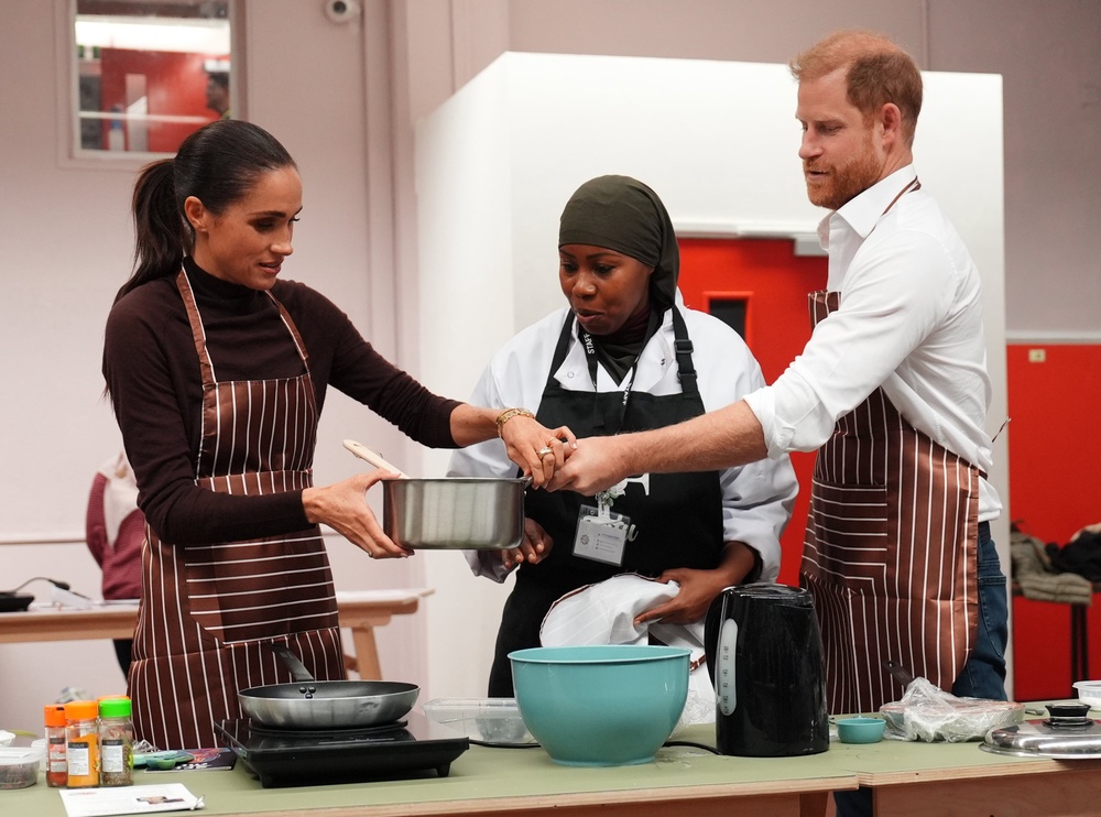 The Duke and Duchess of Sussex helped with the cooking (Annabel Lee-Ellis/PA) (PA Wire)