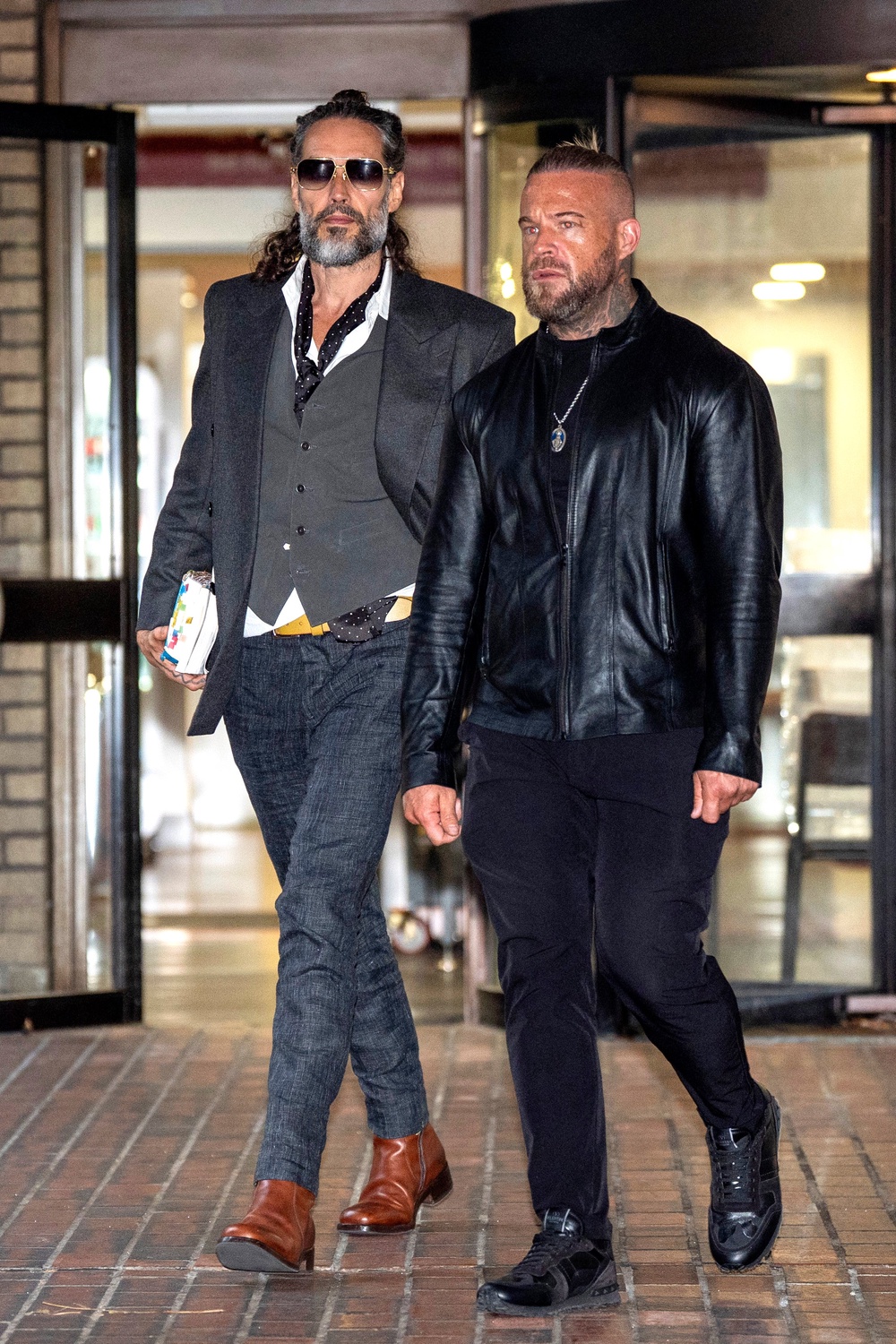 Brand leaving court with his bodyguard on Thursday (PA)