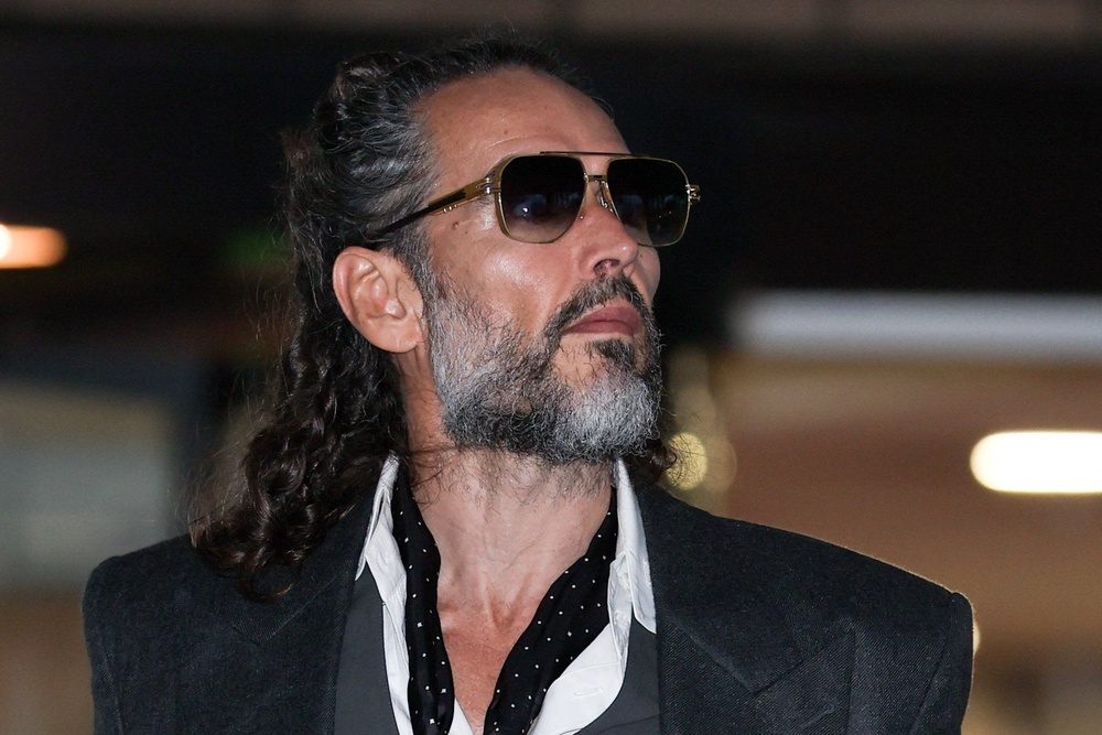 Russell Brand leaving court (Reuters)
