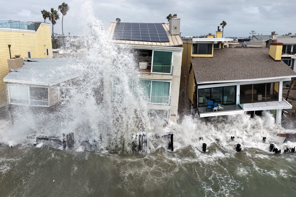 Pacific Ocean waves wash into damaged homes amid high surf generated by Tropical Storm Rachel (Getty)