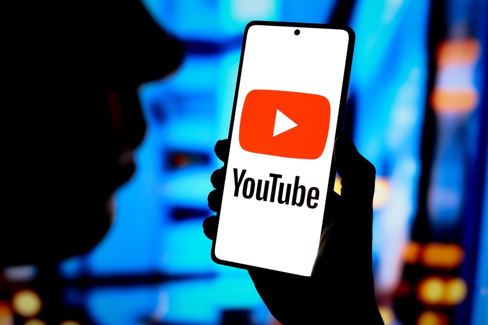 The YouTube logo is displayed on a smartphone screen (Alamy?PA)