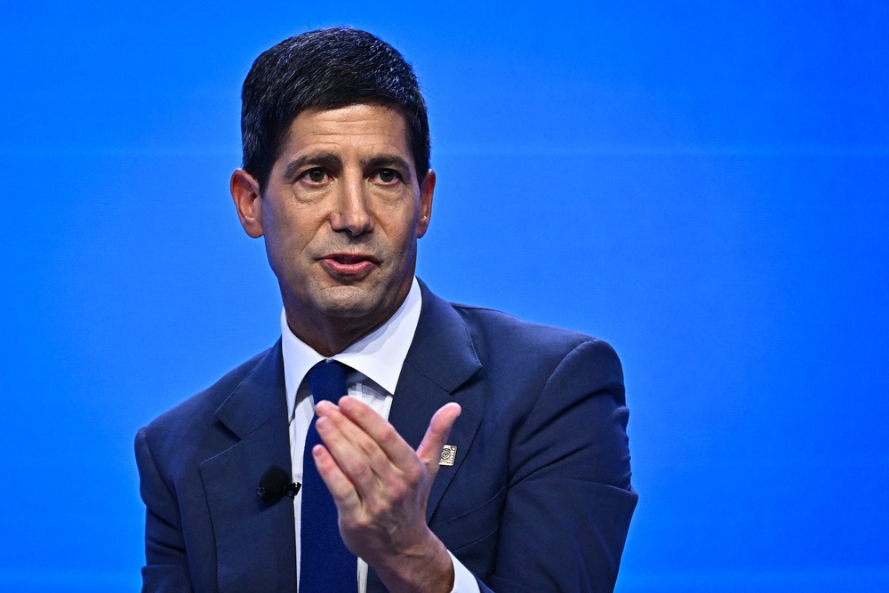 Chairman of the US Federal Reserve Kevin Warsh (R) speaks during a 