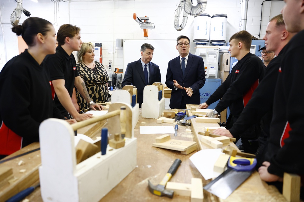 Andy Burnham, centre right, and Douglas Alexander during a visit to to a college in Motherwell, Lanarkshire (Jeff Mitchell/PA) (PA Wire)