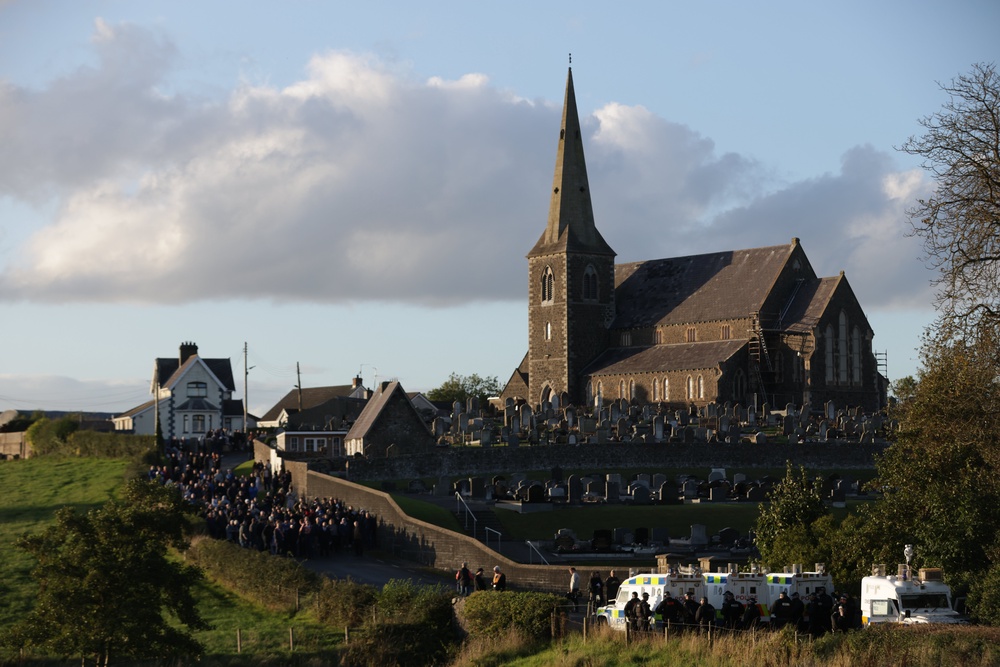 Loyalists gather near Drumcree Church as police form a barricade close to the Garvaghy Road (Peter Morrison/PA) (PA Wire)