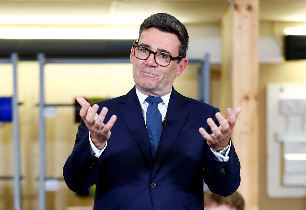 Andy Burnham is launching a nationwide campaign reminding passengers to use headphones on trains (PA)