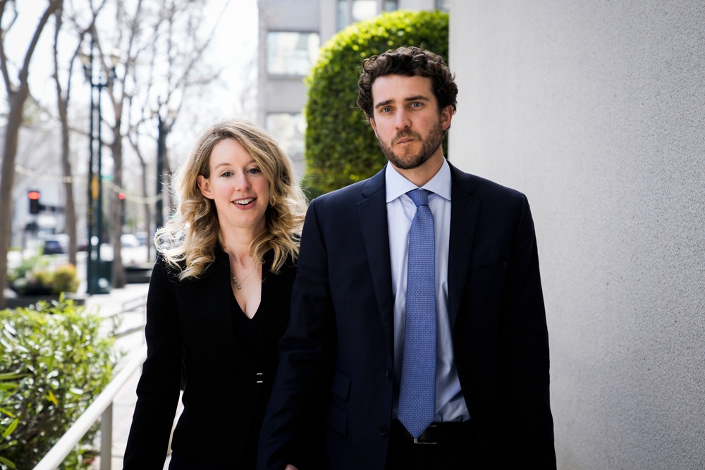 Elizabeth Holmes and her partner Billy Evans, pictured leaving a hearing in San Jose in 2023 (Getty)