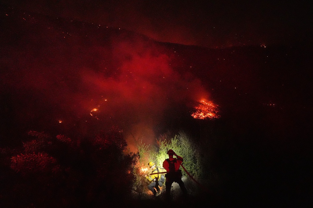 Crews make a stand in front of the Bryson Fire (AP Photo/Jae C. Hong)