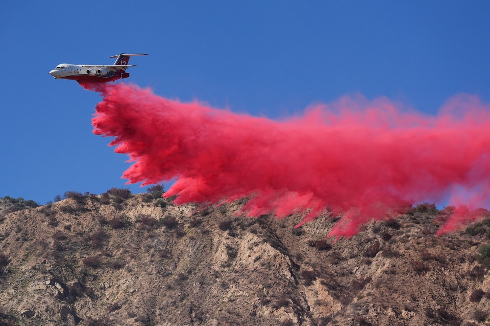 A tanker drops retardant on the Peak Fire (AP Photo/Jae C. Hong)