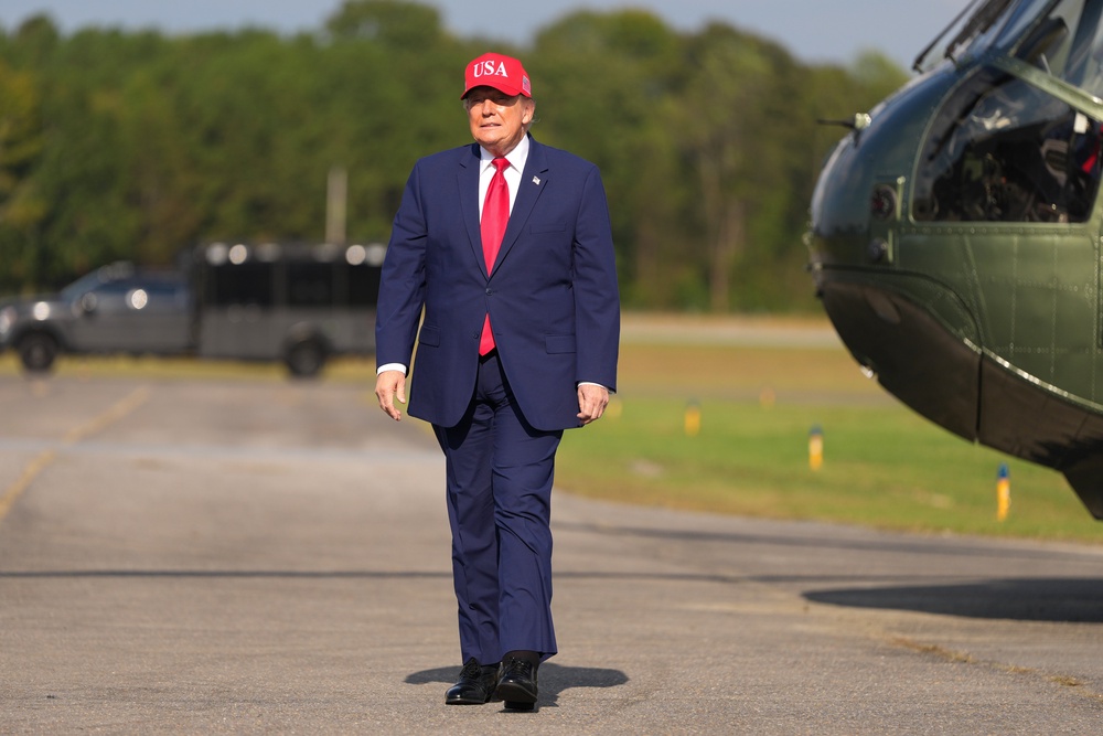 President Donald Trump arrives at a campaign rally at Dalton Municipal Airport in Dalton, Georgia (Mark Schiefelbein/AP) (AP)