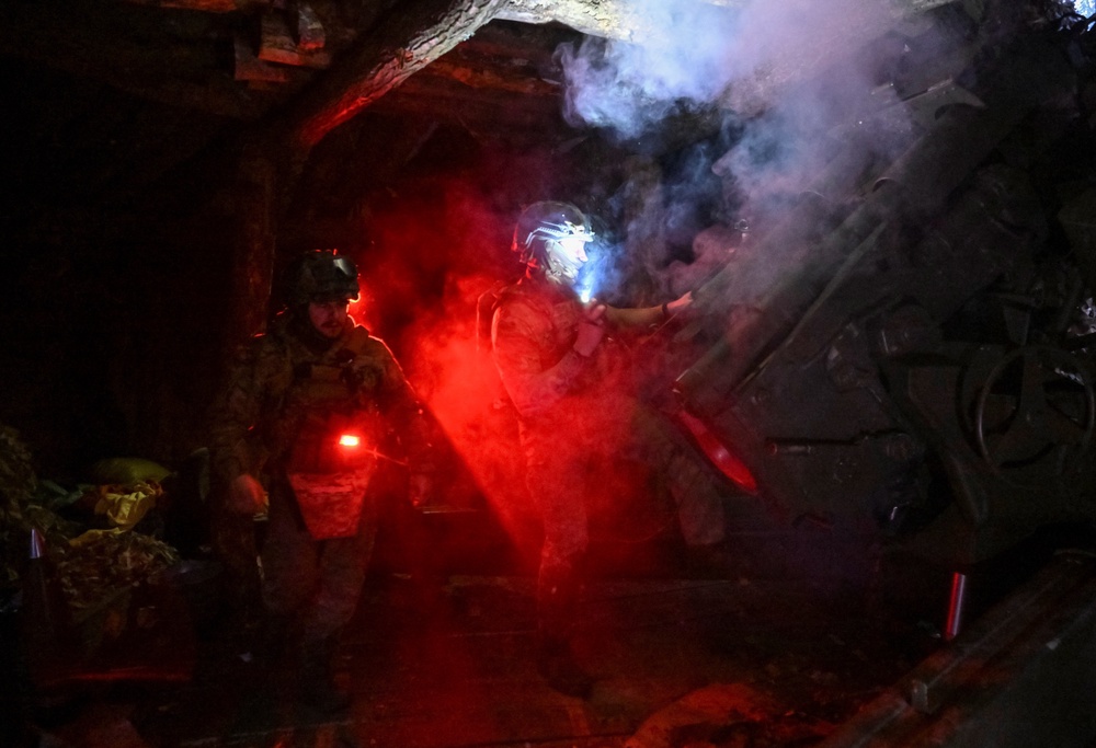 Artillerymen of the Special Rifle Police Battalion of Zaporizhzhia region fire a M94 howitzer towards Russian troops (Reuters)