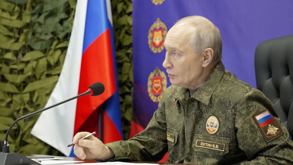 Russian president Vladimir Putin visits a command post of Russia's joint force grouping, in the course of the Russia-Ukraine conflict, at an unidentified location, in this still image taken from a video released on 16 October 2026 (Reuters)