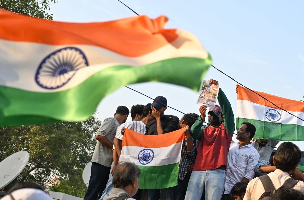 Supporters of the Cockroach Janta Party take part in a protest march with Indian tricolour fla on 16 October 2026 (Getty)
