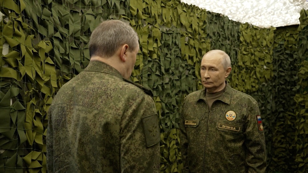 Putin listens to Russian military chief Valery Gerasimov at a command post at an undisclosed location on Friday, in a still image taken from a video released by the Kremlin (Reuters)