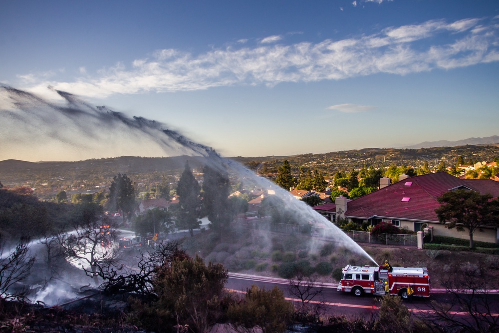 Firefighters battle the Norte Fire in San Juan Capistrano, California (AFP/Getty)