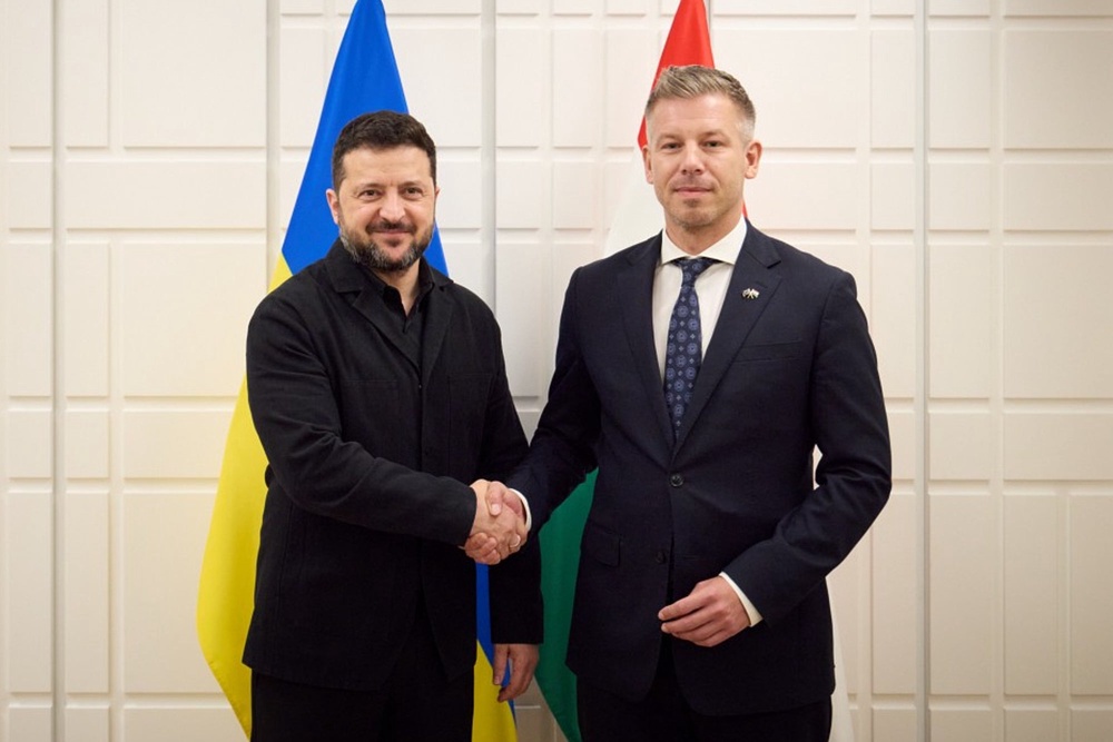 Ukrainian President Volodymyr Zelenskyy, left, shakes hands with Hungary's Prime Minister Peter Magyar in Brussels, Friday, Oct. 16 (AP)