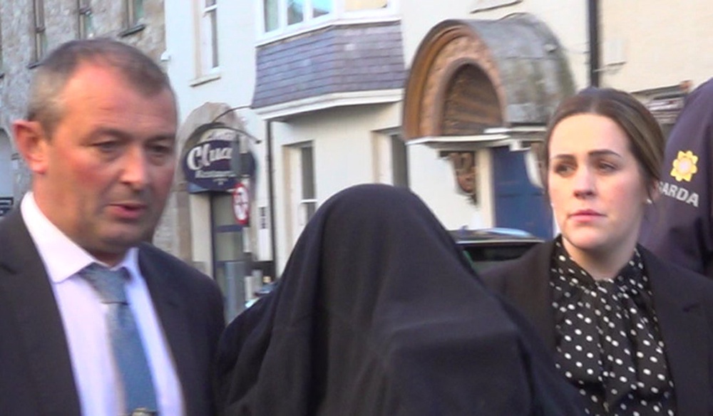 A woman (centre) arriving for a special sitting at Clonmel District Court (Jonathan McCambridge/PA) (PA Wire)