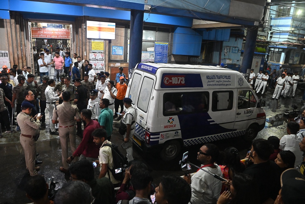 An ambulance carrying Durga Puja pandal stampede victims arrives at the Calcutta Medical College and Hospital (AFP/Getty)