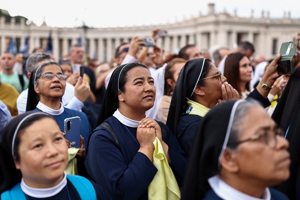 Faithful gather in St. Peter's Square as Pope Leo leads the Angelus prayer from a window of the Apostolic Palace, following his discharge from hospital after surgery for lung cancer, at the Vatican (Reuters)