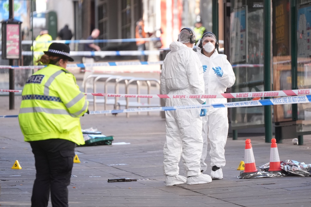 The officer, who is in hospital with a foot wound, had approached two suspects in Angel Row shortly before the incident at 4.50am on Sunday, Nottinghamshire Police said (PA)