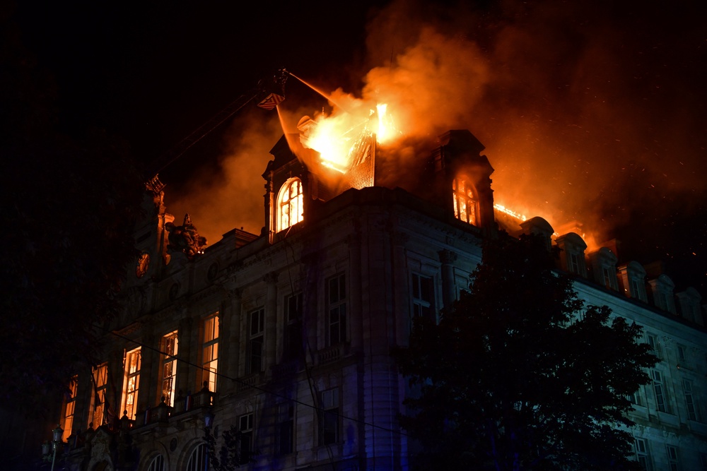 Fire burning and destroying Limoges city hall after a group of individuals forced entry into the building (AFP/Getty)