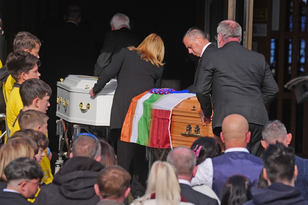 The coffins are brought into the parish centre in Waterford (Brian Lawless/PA) (PA Wire)