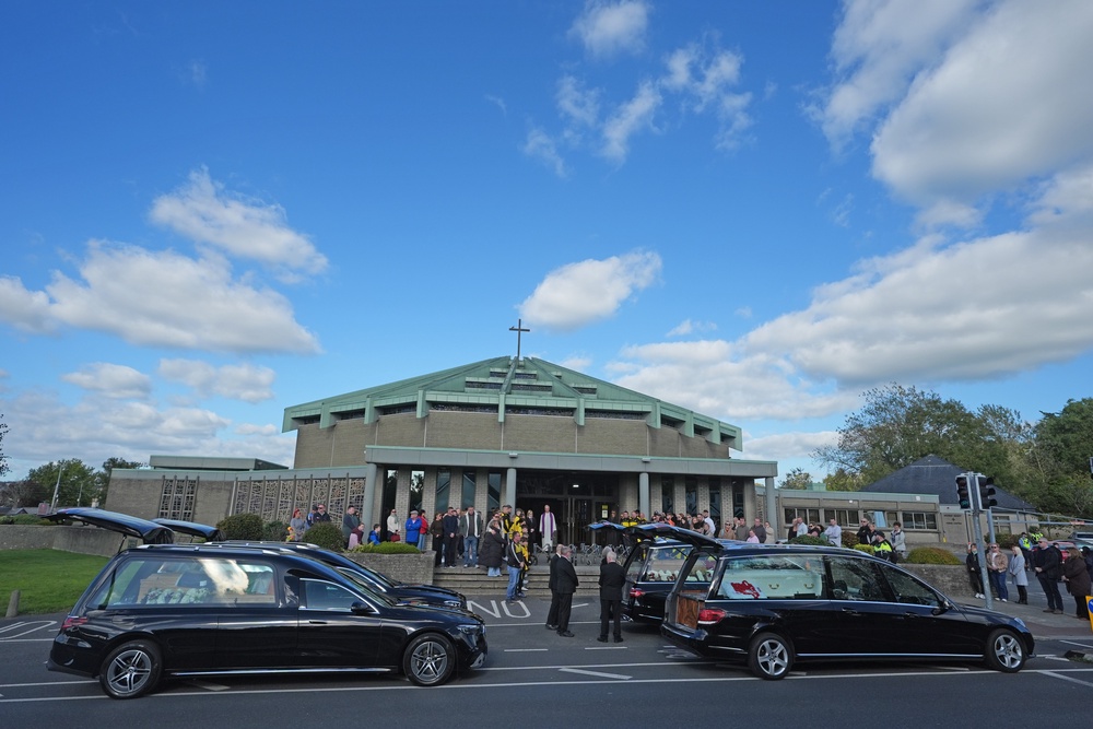 Four hearses carrying the coffins of Philip and Kim English and their sons, Jayden and Callum, arrive at the Sacred Heart Church Parish Centre (Brian Lawless/PA) (PA Wire)