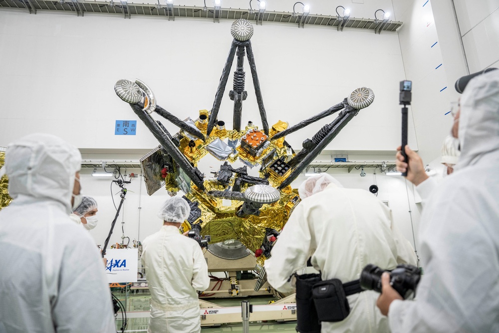Members of the media film Exploration and Return Modules, making up the Martian Moons eXploration (MMX) spacecraft, at the Tanegashima Space Center in Minamitane, Kagoshima prefecture on August 13, 2026 (AFP/Getty)