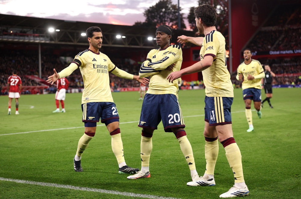 Noni Madueke celebrates after breaking the deadlock for Arsenal (Getty)