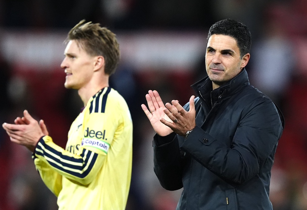 Arsenal manager Mikel Arteta (right) and Martin Odegaard applaud the fans (Mike Egerton/PA)