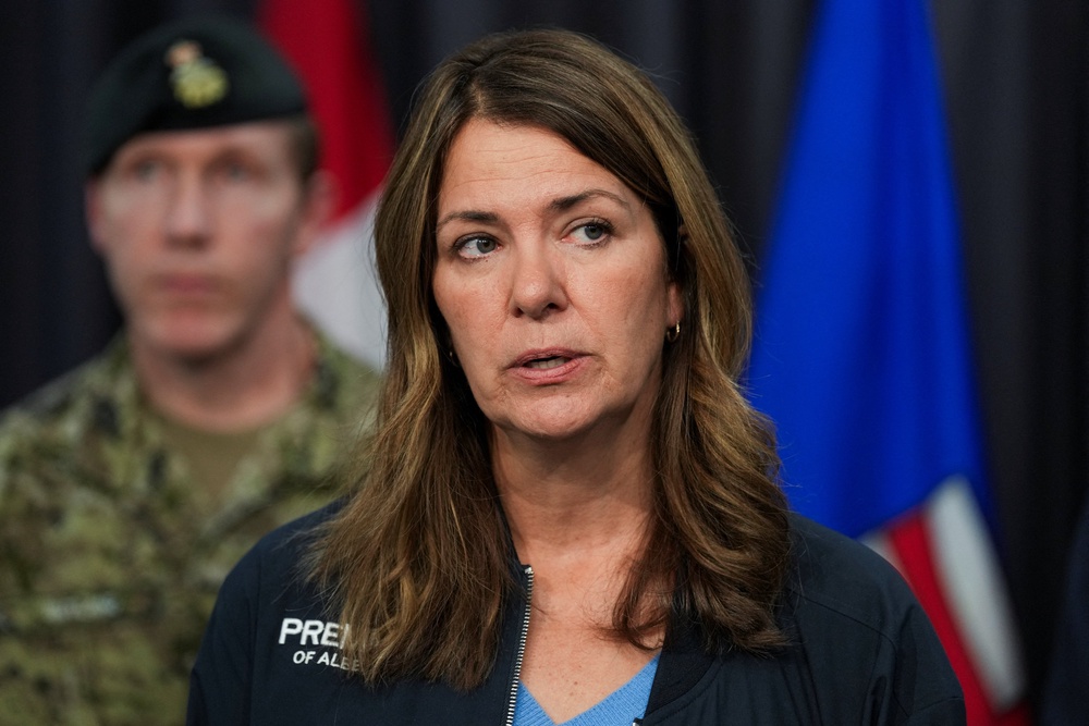 Alberta Premier Danielle Smith speaks during a press conference following a serious incident that resulted in a fire that caused deaths and injuries at Canadian Forces Base (Reuters)