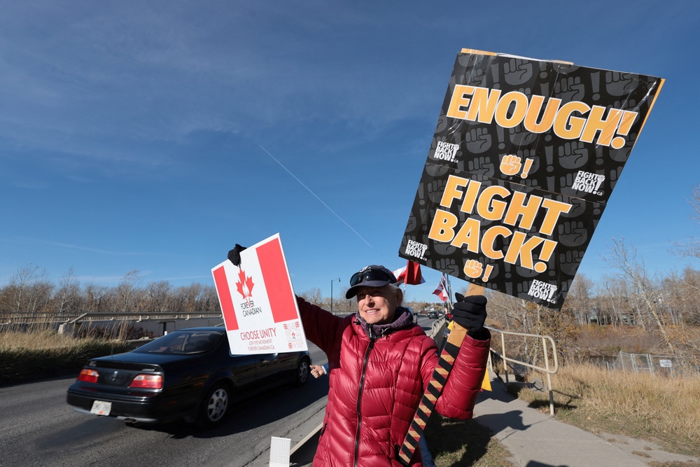 A supporter of the pro-Canada group Forever Canadian participates in an event, one day before the non-binding referendum (Reuters)