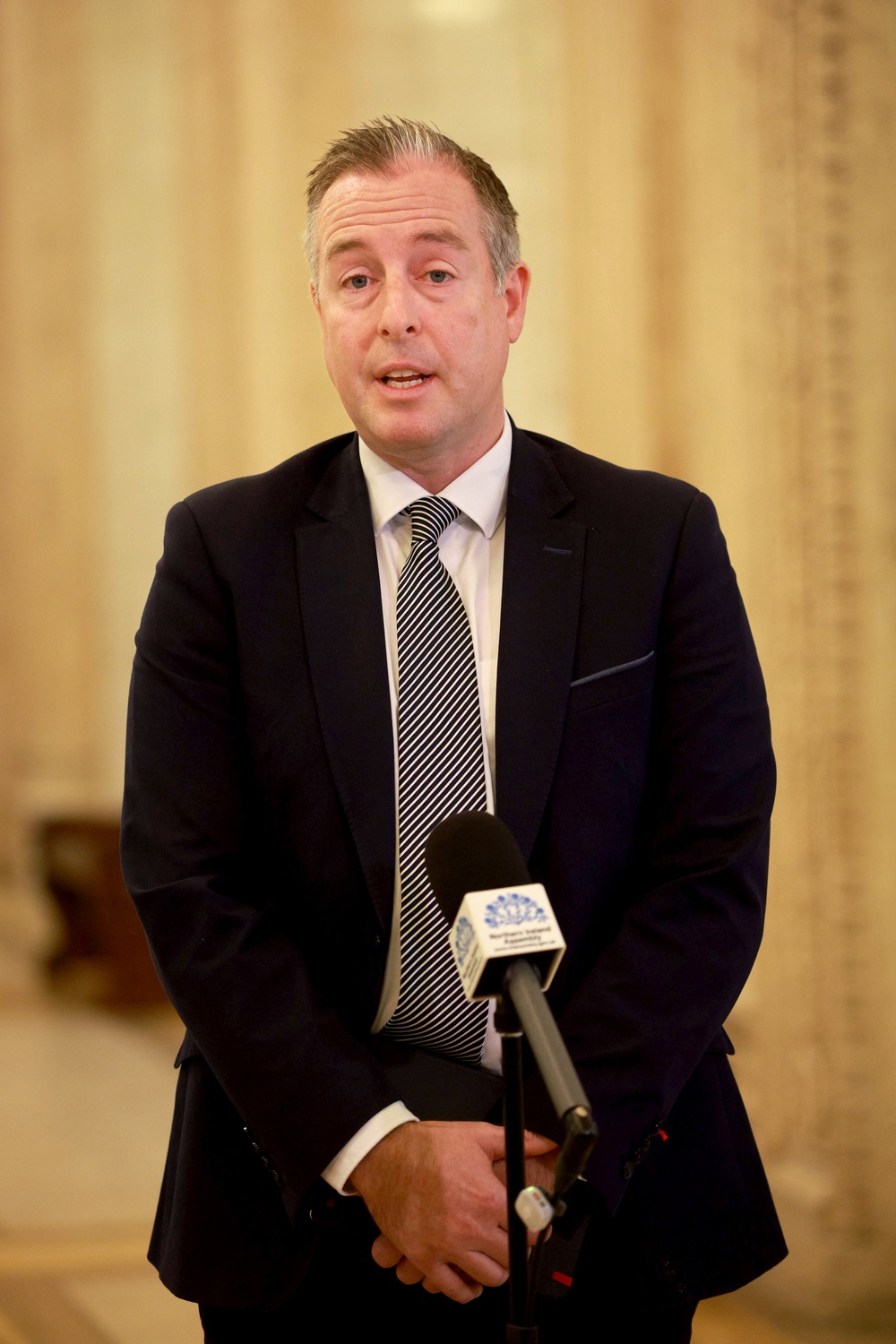 Education Minister Paul Givan speaking to the media at Parliament Buildings, Stormont in Belfast (PA)