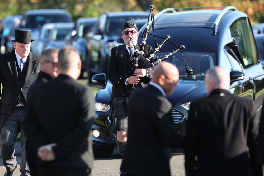 A piper led the cortege (Robert Perry/PA) (PA Wire)