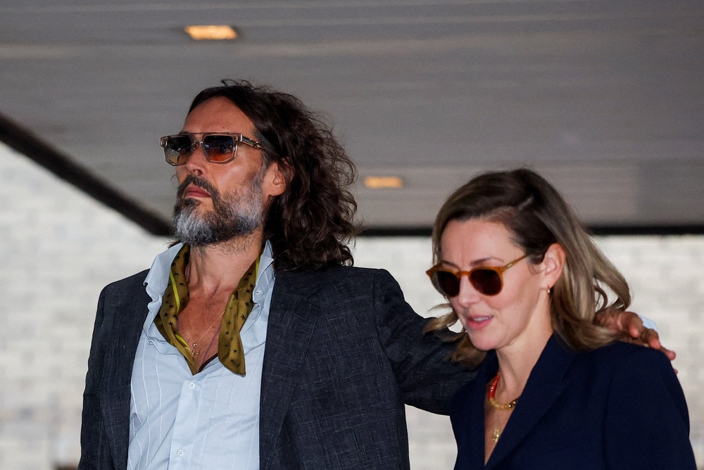 Russell Brand at Southwark Crown Court with his wife, Laura Gallacher (Reuters)
