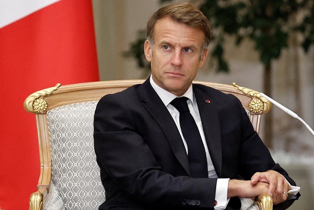 France's President Emmanuel Macron, visiting Abu Dhabi on Monday, has been criticised for failing to tackle the crisis (AFP/Getty)